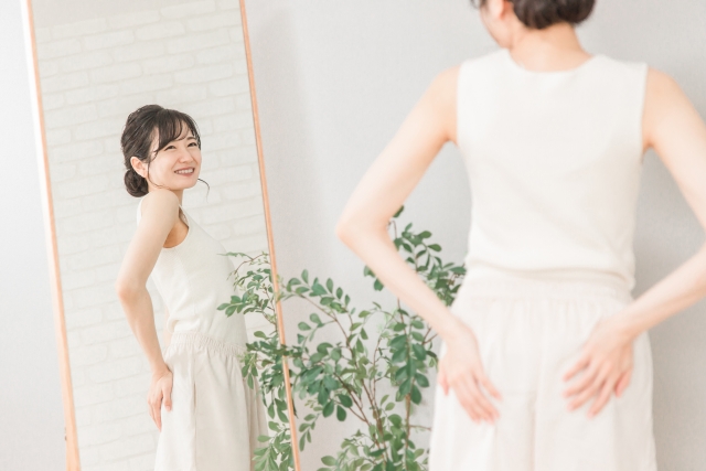 マシンピラティスで変化を感じている女性